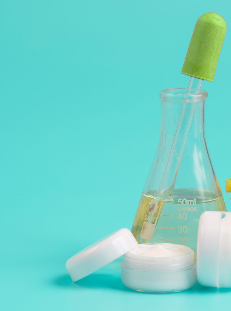 Women's cosmetic products placed on a blue background.